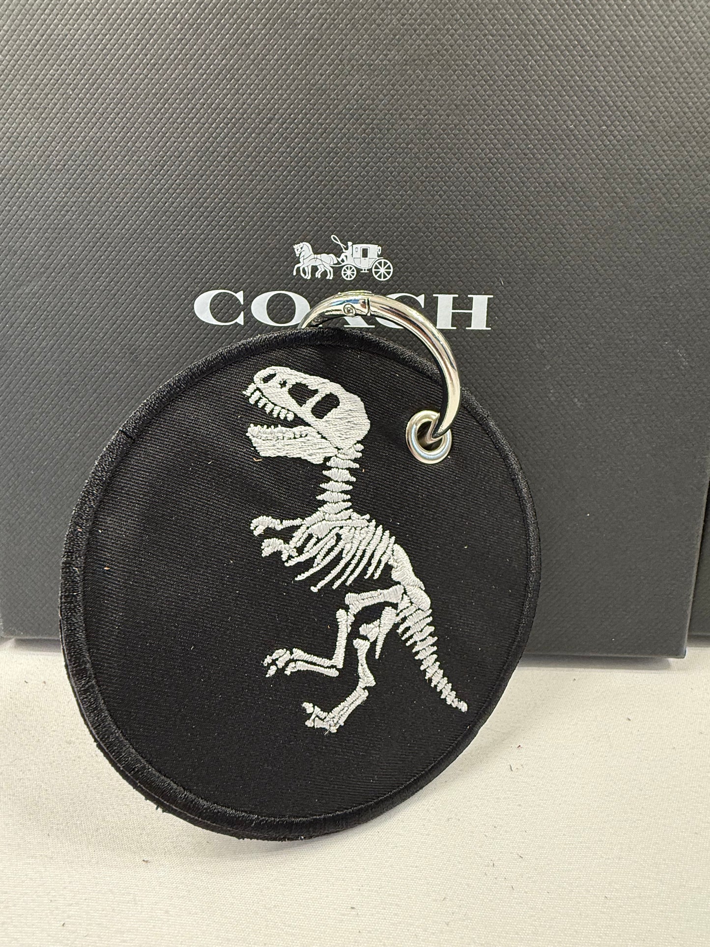 Repurposed Piece of a Coach Handbag with T-Rex Skeleton Patch Bag Charm