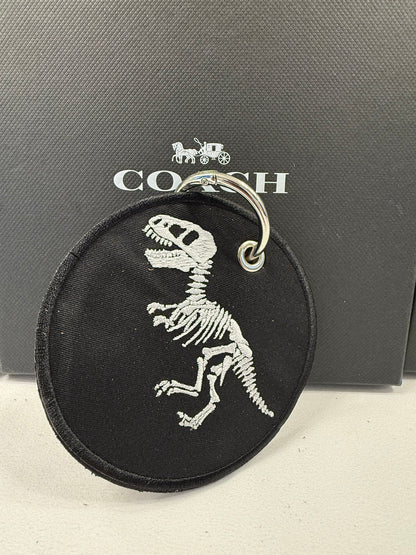 Repurposed Piece of a Coach Handbag with T-Rex Skeleton Patch Bag Charm