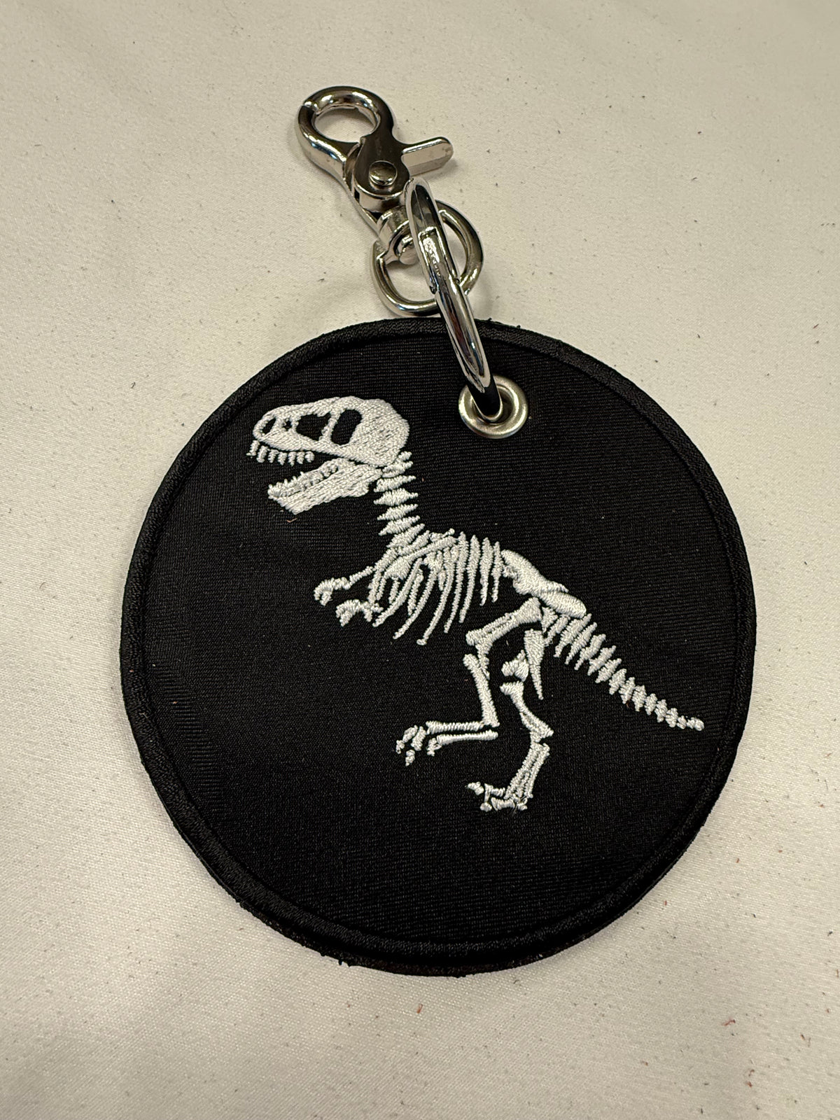 Repurposed Piece of a Coach Handbag with T-Rex Skeleton Patch Bag Charm