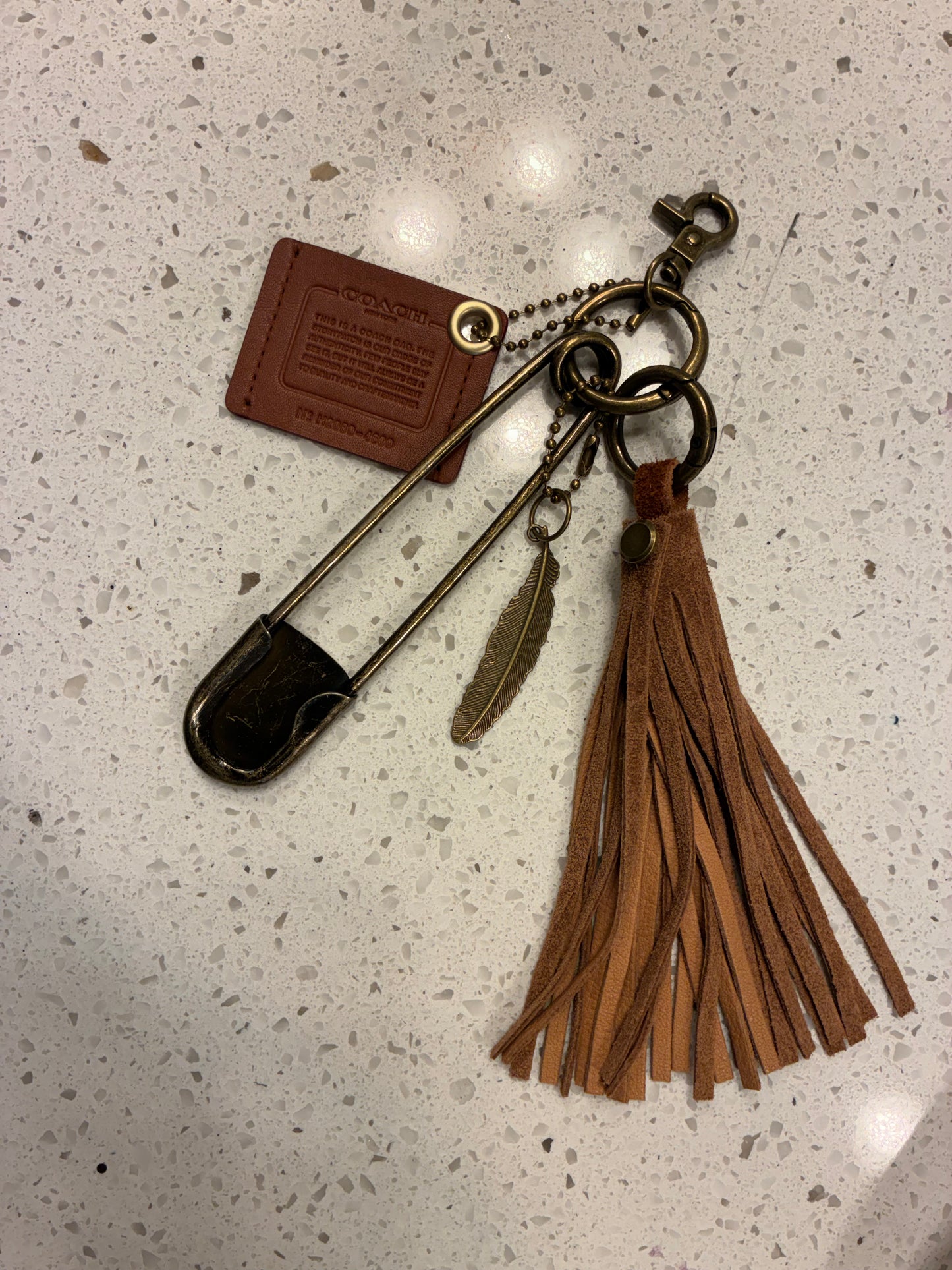 Upcrafted Coach Creed Cluster Bag Charm Suede Tassel – Repurposed Coach Creed Story Patch Bag Charm Cluster Brown Suede Tassel – Antique Brass Hardware