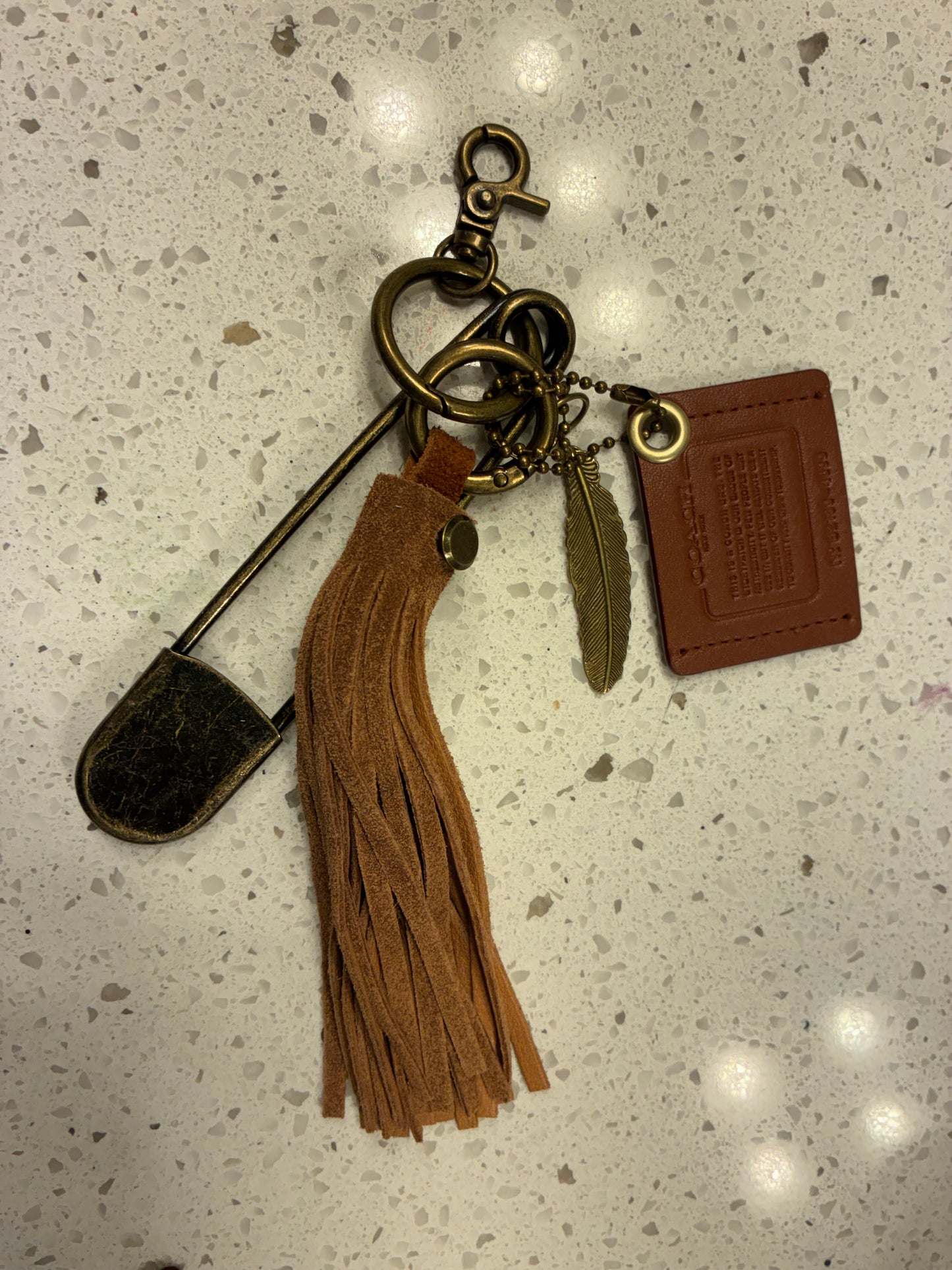 Upcrafted Coach Creed Cluster Bag Charm Suede Tassel – Repurposed Coach Creed Story Patch Bag Charm Cluster Brown Suede Tassel – Antique Brass Hardware