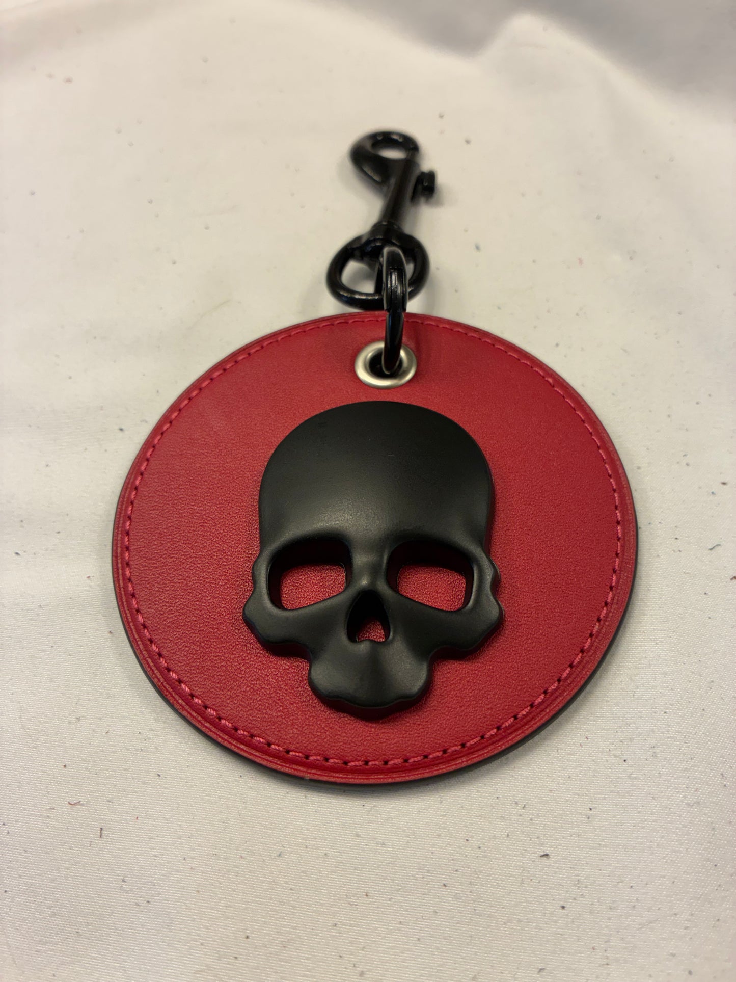Repurposed Red Leather Coach Coaster Bag Charm with Black Skull