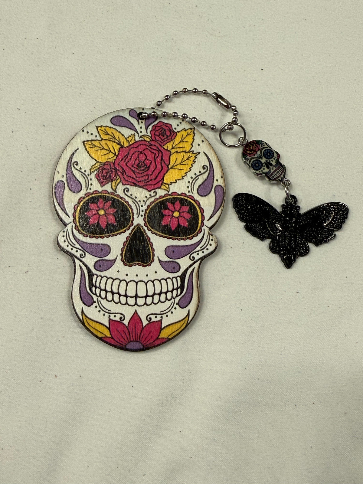 Sugar Skull Embossed on Wood Cut Out Bag Charm with Sugar Skull and Skull Moth Charm