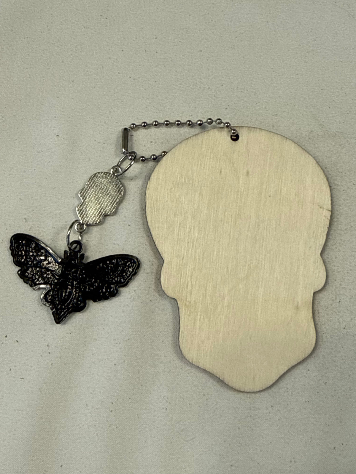 Purple Sugar Skull Embossed on Wood and Sugar Skull and Skull Moth Charm Bag Charm