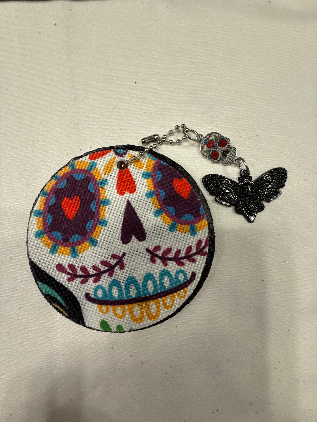 Dia De Los Muertos Textile on a Painted Leather Disc with Sugar Skull and Skull Moth Charm Bag Charm