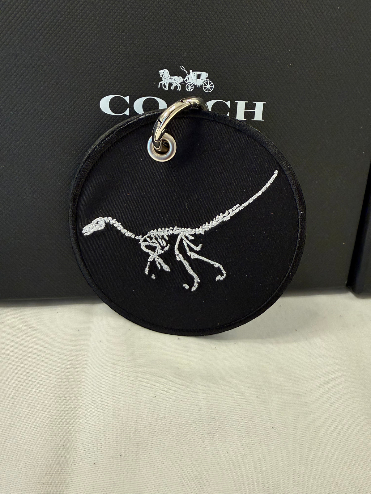 Dinosaur Skeleton Patch on a Piece of Repurposed Coach Handbag Bag Charm