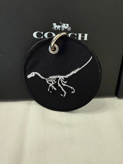 Dinosaur Skeleton Patch on a Piece of Repurposed Coach Handbag Bag Charm
