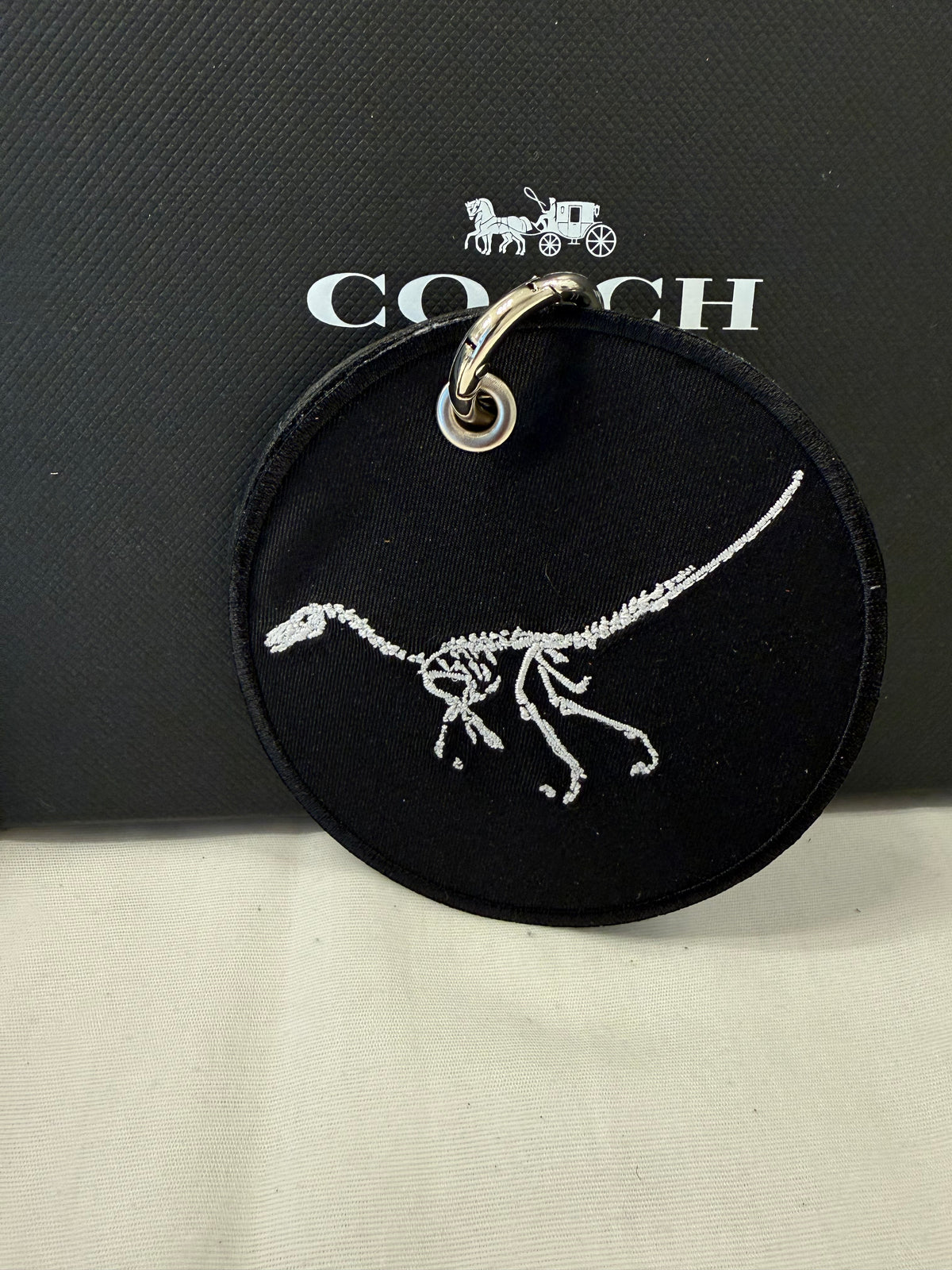 Dinosaur Skeleton Patch on a Piece of Repurposed Coach Handbag Bag Charm