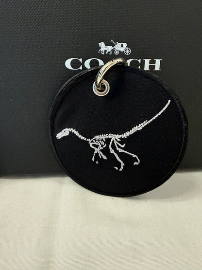 Dinosaur Skeleton Patch on a Piece of Repurposed Coach Handbag Bag Charm