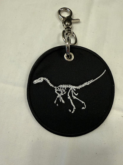 Dinosaur Skeleton Patch on a Piece of Repurposed Coach Handbag Bag Charm