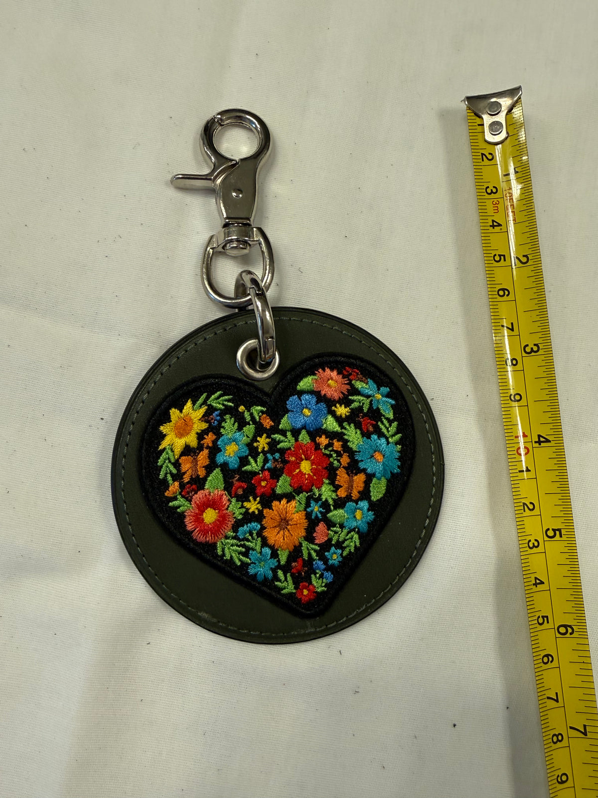 Repurposed Olive Coach Coaster with an Embroidered Heart Patch Bag Charm