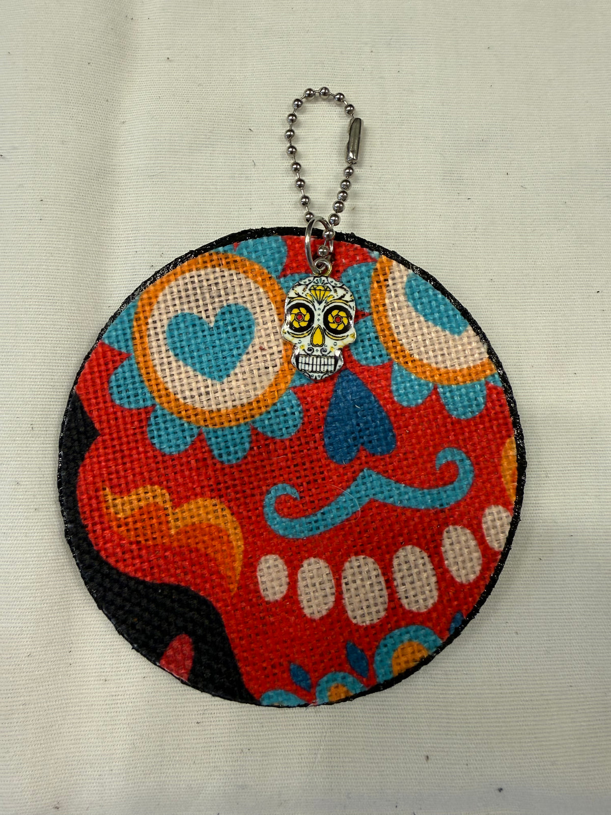 Sugar Skull Textile on a Painted Leather Disc with Charm