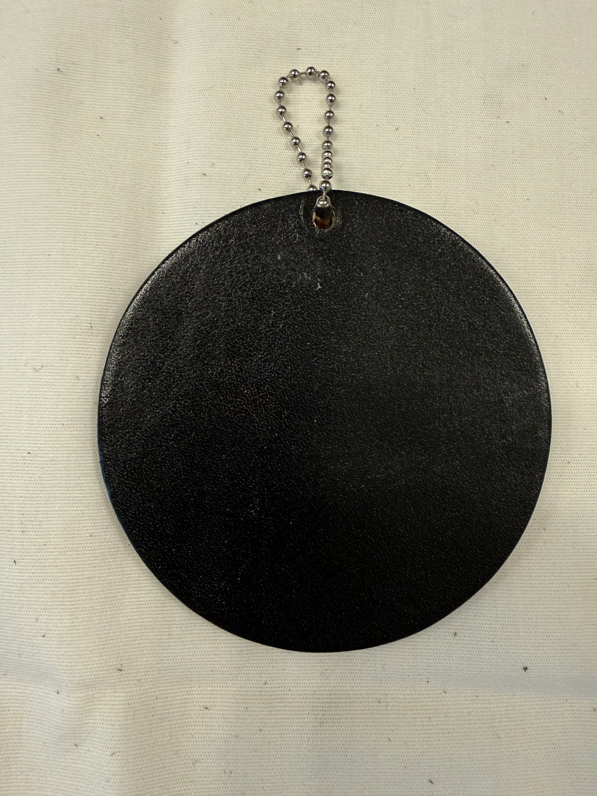 Sugar Skull Textile on a Painted Leather Disc with Charm