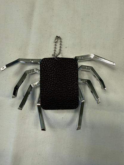 Metallic Plastic Spider on a Piece of a Coach Lora Bucket Bag Hangtag Style Charm