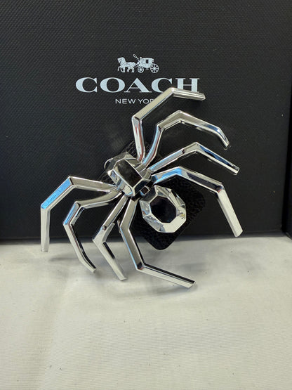 Metallic Plastic Spider on a Piece of a Coach Lora Bucket Bag Hangtag Style Charm