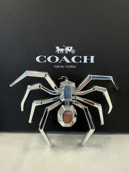 Metallic Plastic Spider on a Piece of a Coach Lora Bucket Bag Hangtag Style Charm
