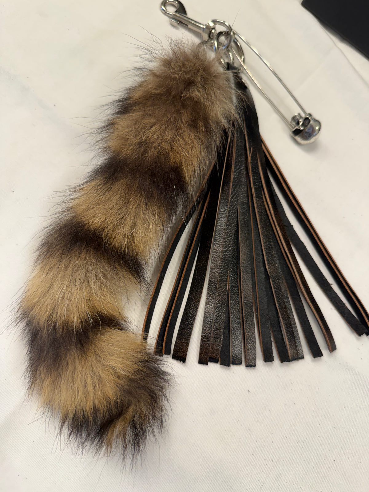 Handcut Painted Distressed Leather Tassel with Faux Fur Racoon Tail and Skull Safety Pin Bag Charm