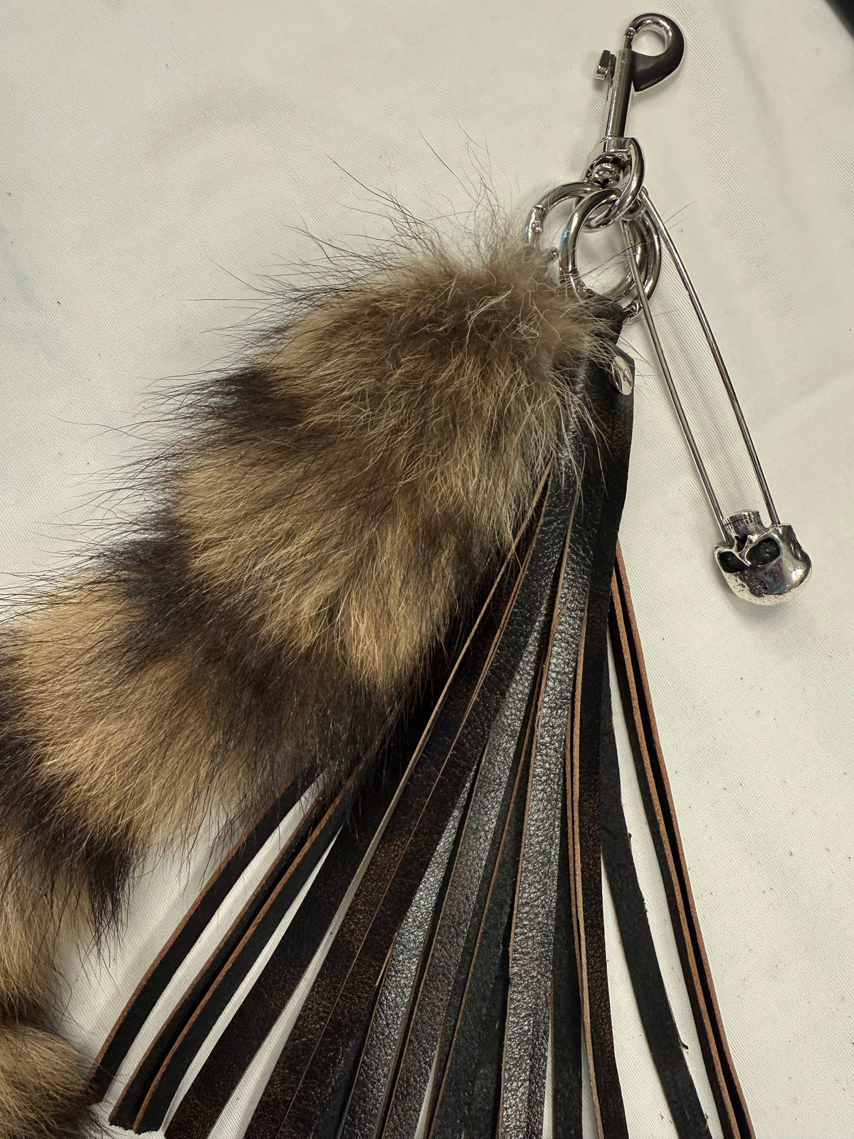 Handcut Painted Distressed Leather Tassel with Faux Fur Racoon Tail and Skull Safety Pin Bag Charm