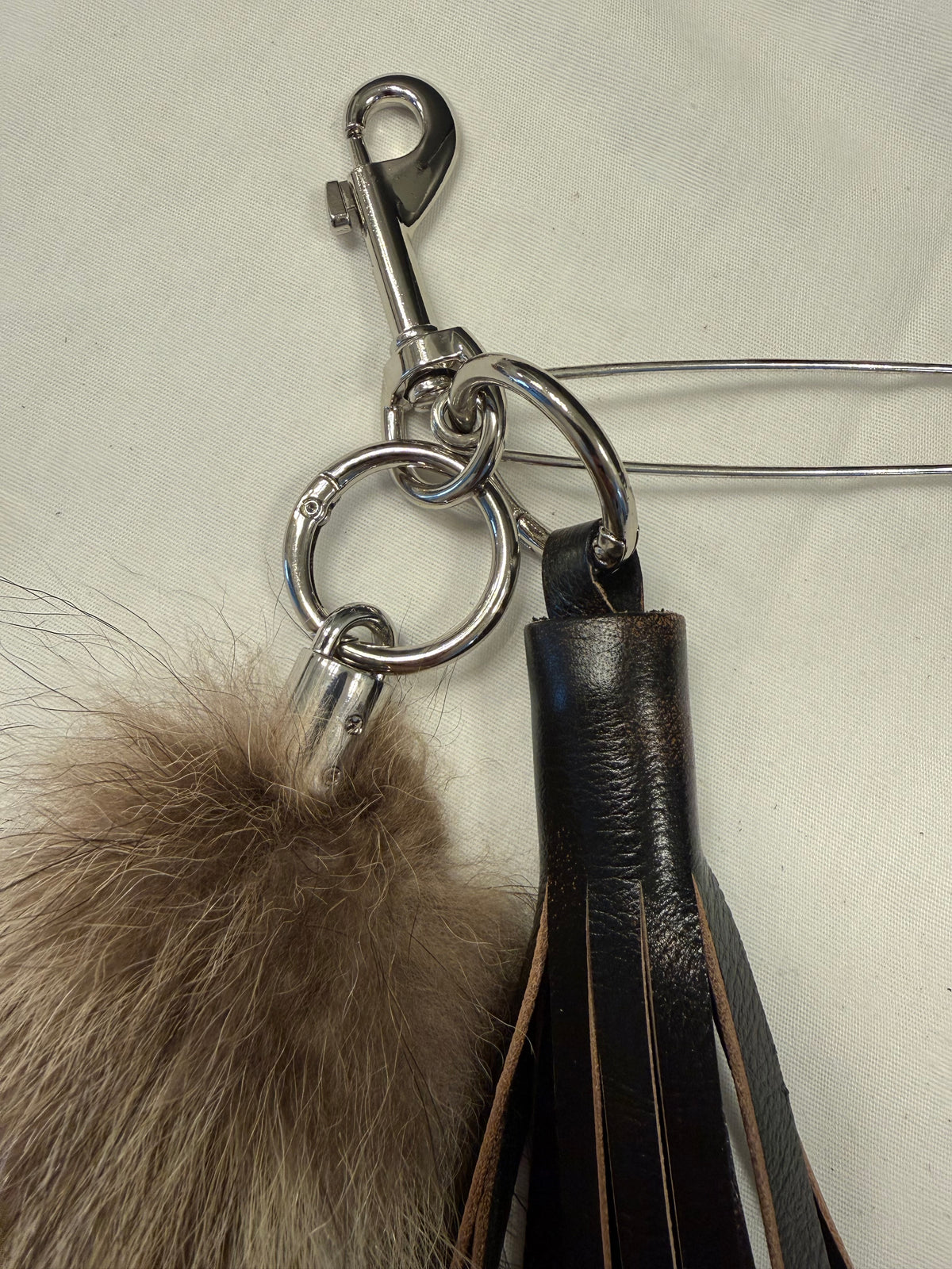 Handcut Painted Distressed Leather Tassel with Faux Fur Racoon Tail and Skull Safety Pin Bag Charm