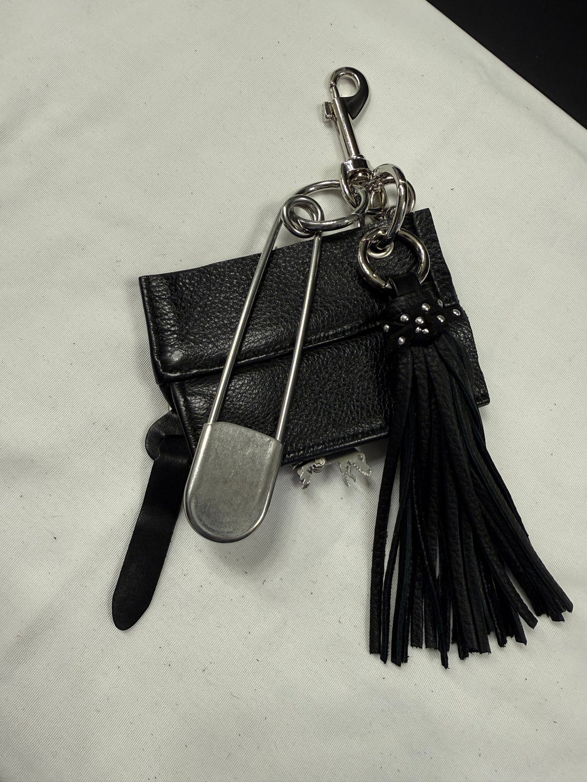 Repurposed Piece of a Coach Motorcycle Jacket, XL Safety Pin, Metal T-Rex, and Leather Tassel Bag Charm Cluster