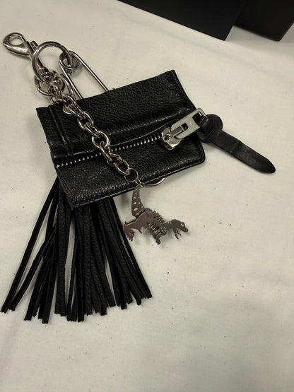 Repurposed Piece of a Coach Motorcycle Jacket, XL Safety Pin, Metal T-Rex, and Leather Tassel Bag Charm Cluster