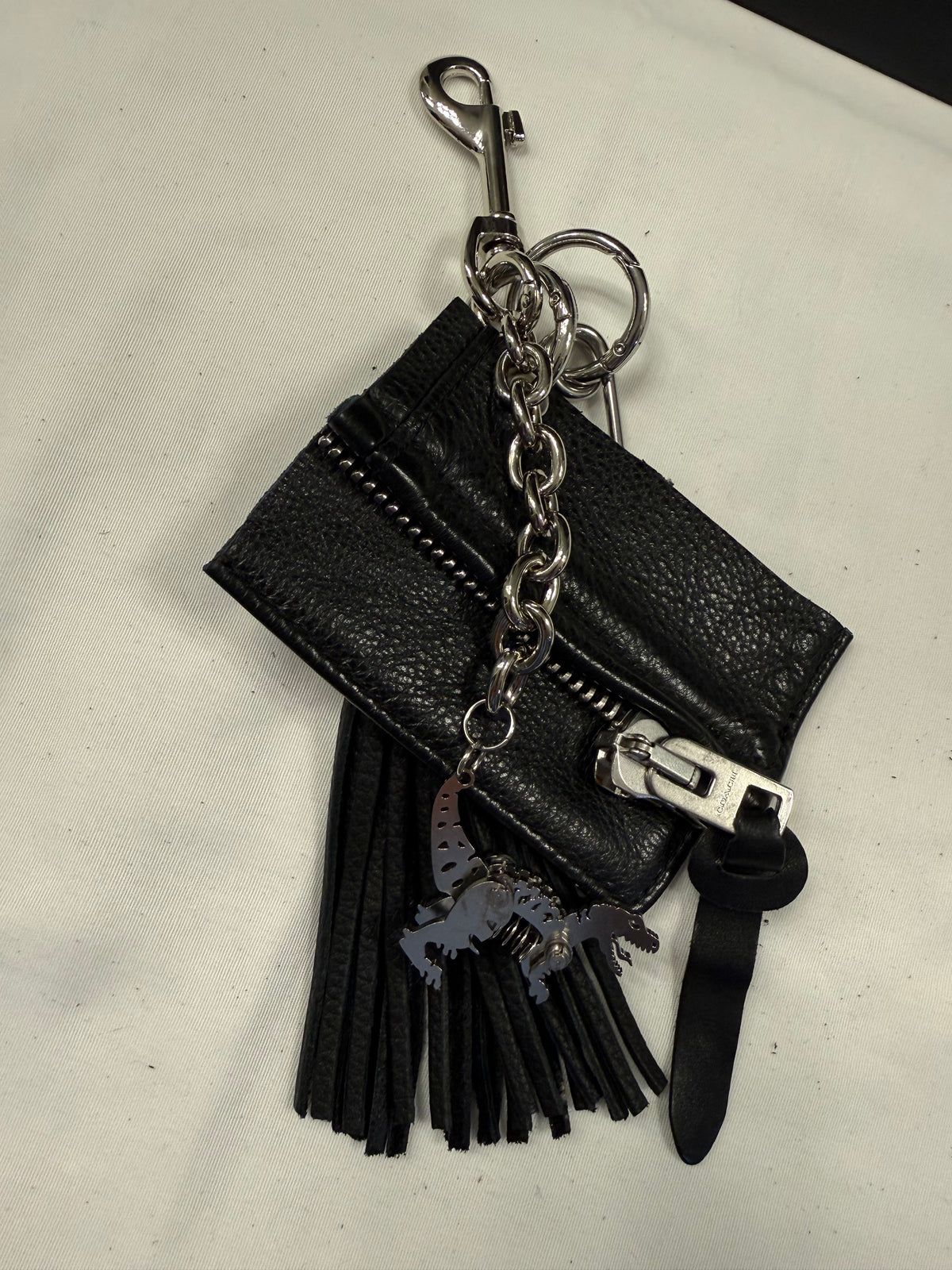 Repurposed Piece of a Coach Motorcycle Jacket, XL Safety Pin, Metal T-Rex, and Leather Tassel Bag Charm Cluster