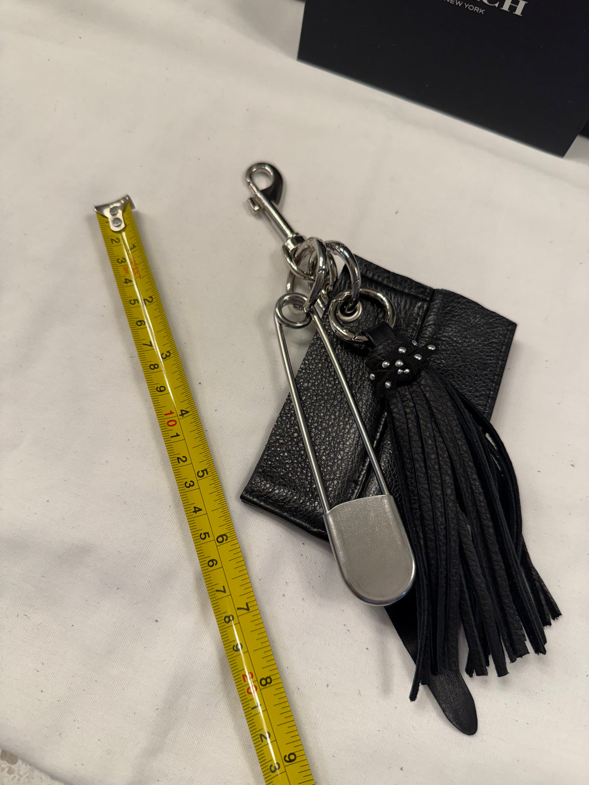 Repurposed Piece of a Coach Motorcycle Jacket, XL Safety Pin, Metal T-Rex, and Leather Tassel Bag Charm Cluster