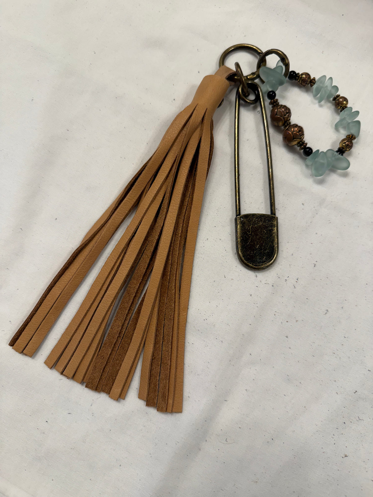 Bag Charm Cluster with Sandstone Pebbled Leather Tassel, XL Safety Pin, and Beaded Bracelet