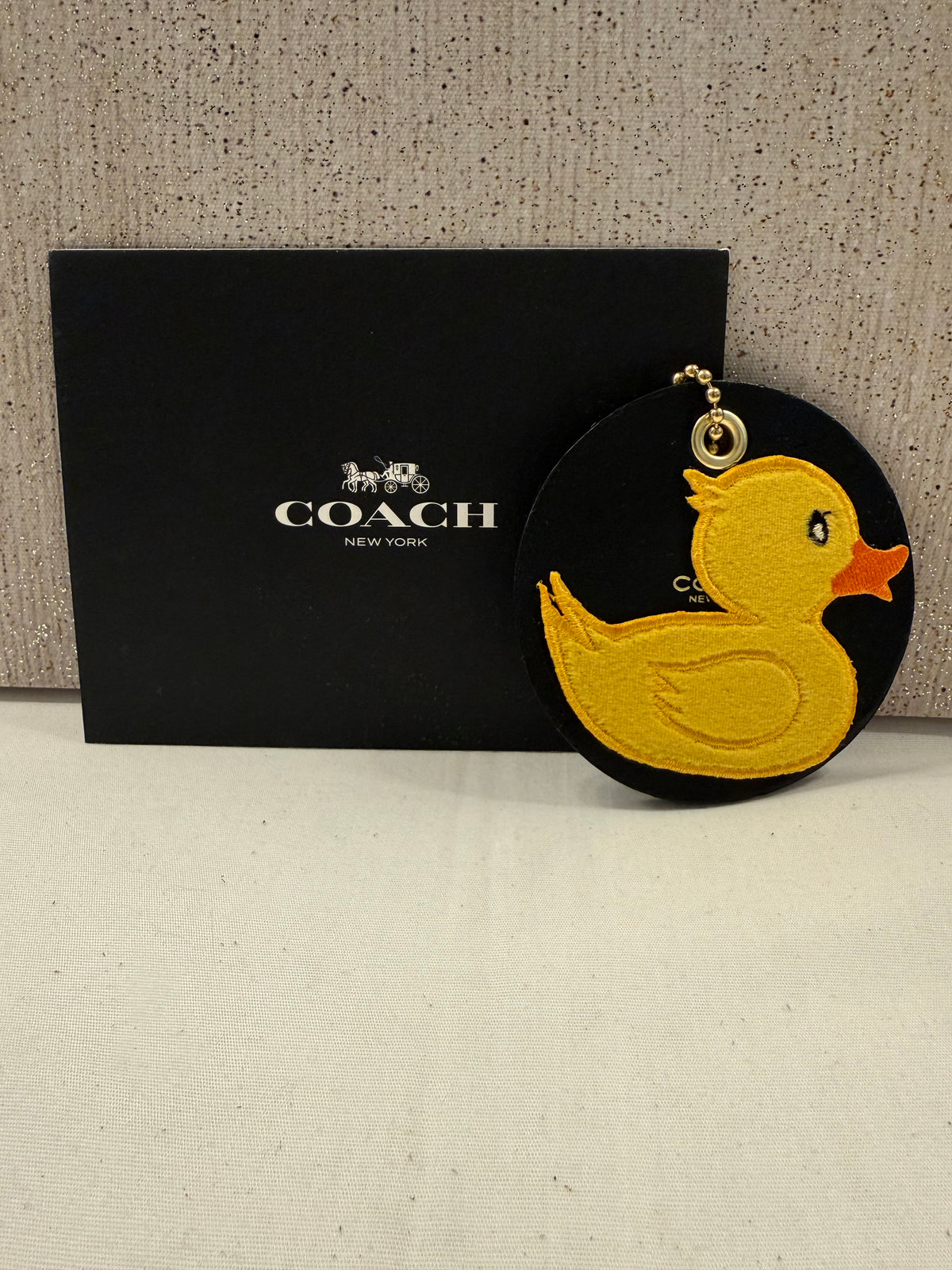 Repurposed Piece of a Coach Coaster Holder with a Rubber Ducky Patch Bag Charm