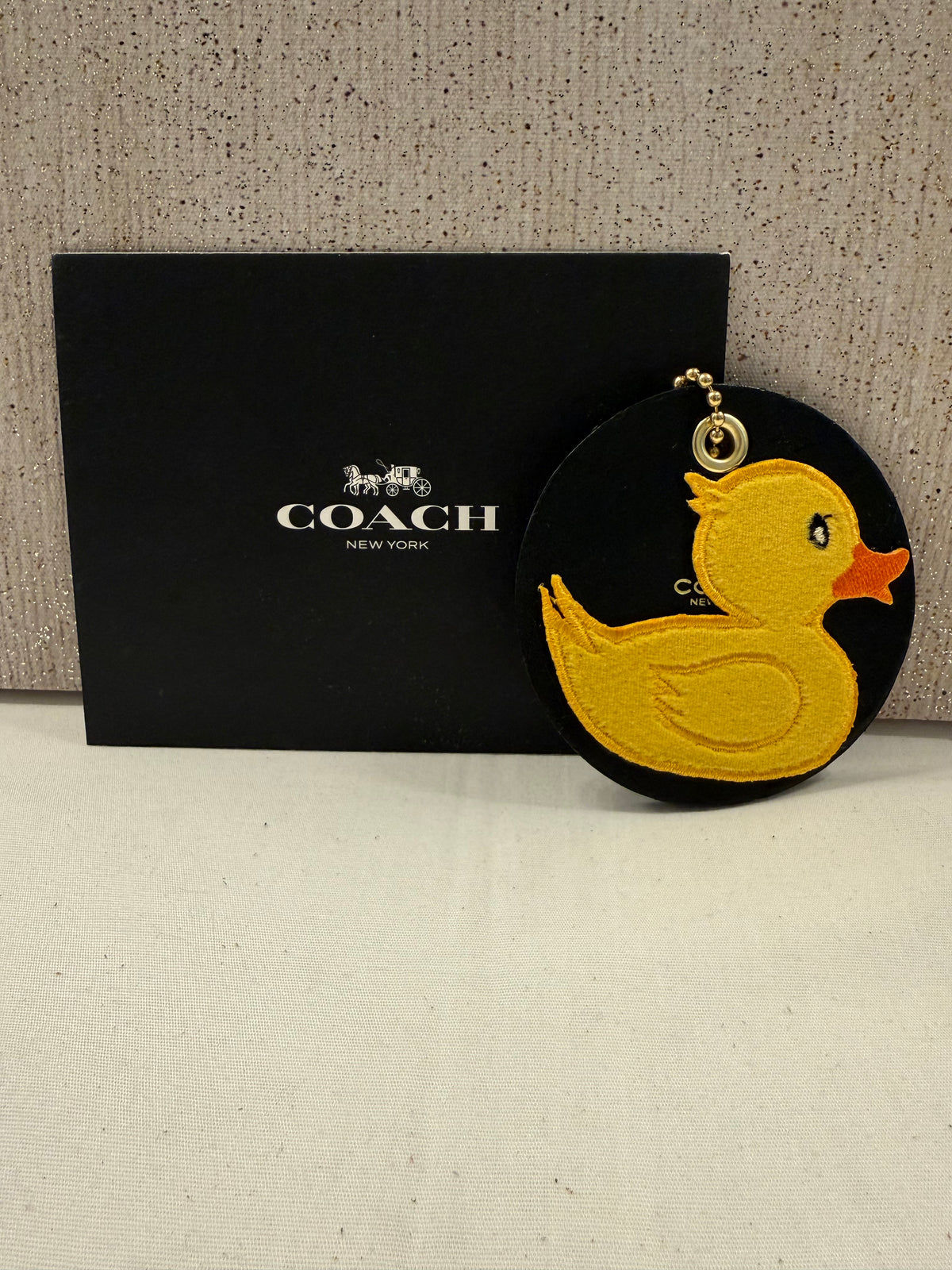Repurposed Piece of a Coach Coaster Holder with a Rubber Ducky Patch Bag Charm