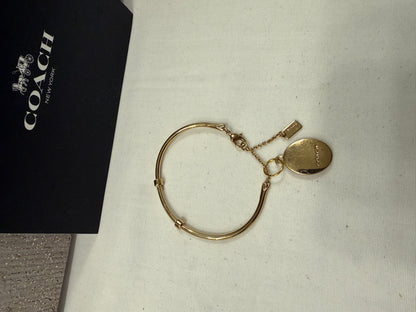 Repurposed Coach Gold Tone Charm Bracelet with Coach Pink and Gold Tone Cameo Charm