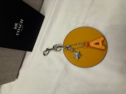 Repurposed Retro Coach Coaster with an A initial and a Coach Rhinestone Star Charm Bag Charm