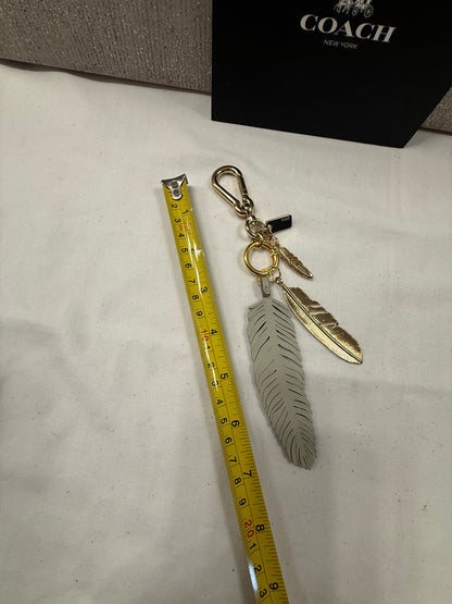 Repurposed Coach Feather and Two Gold Tone Feather Charms on a Coach Clasp