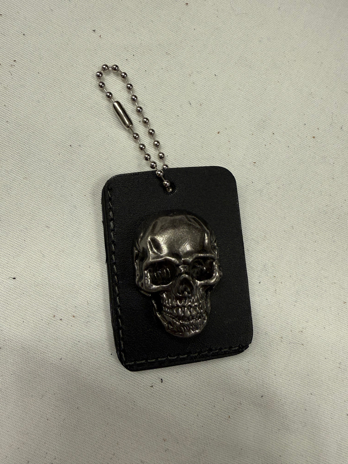 Repurposed Piece of a Coach Tic Tac Toe Board with Gunmetal Skull Rivet Bag Charm
