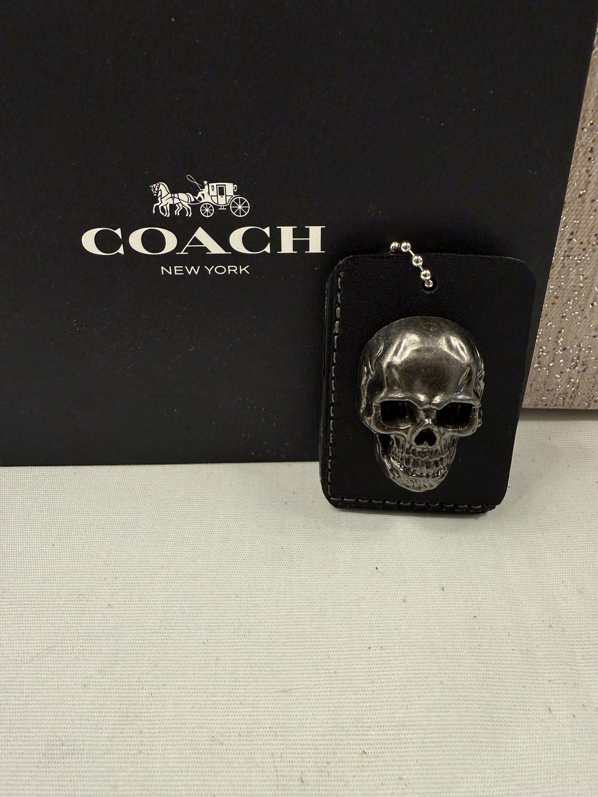 Repurposed Piece of a Coach Tic Tac Toe Board with Gunmetal Skull Rivet Bag Charm