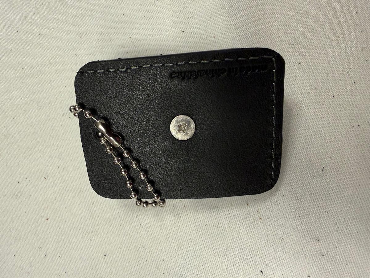 Repurposed Piece of a Coach Tic Tac Toe Board with Gunmetal Skull Rivet Bag Charm