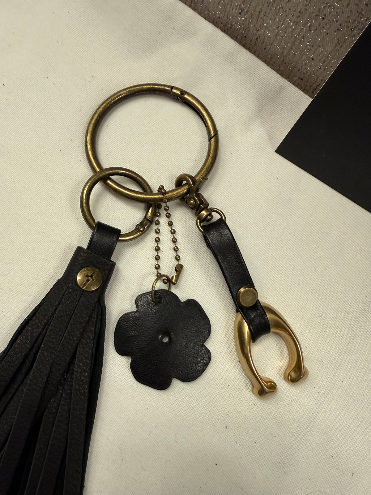 Ships 10.13.26 Bag Charm Cluster with a Repurposed Coach C from Tic Tac Toe Board, Coach Tea Rose, and Handmade Leather Tassel Bag Charm Cluster