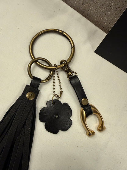 Ships 10.13.26 Bag Charm Cluster with a Repurposed Coach C from Tic Tac Toe Board, Coach Tea Rose, and Handmade Leather Tassel Bag Charm Cluster