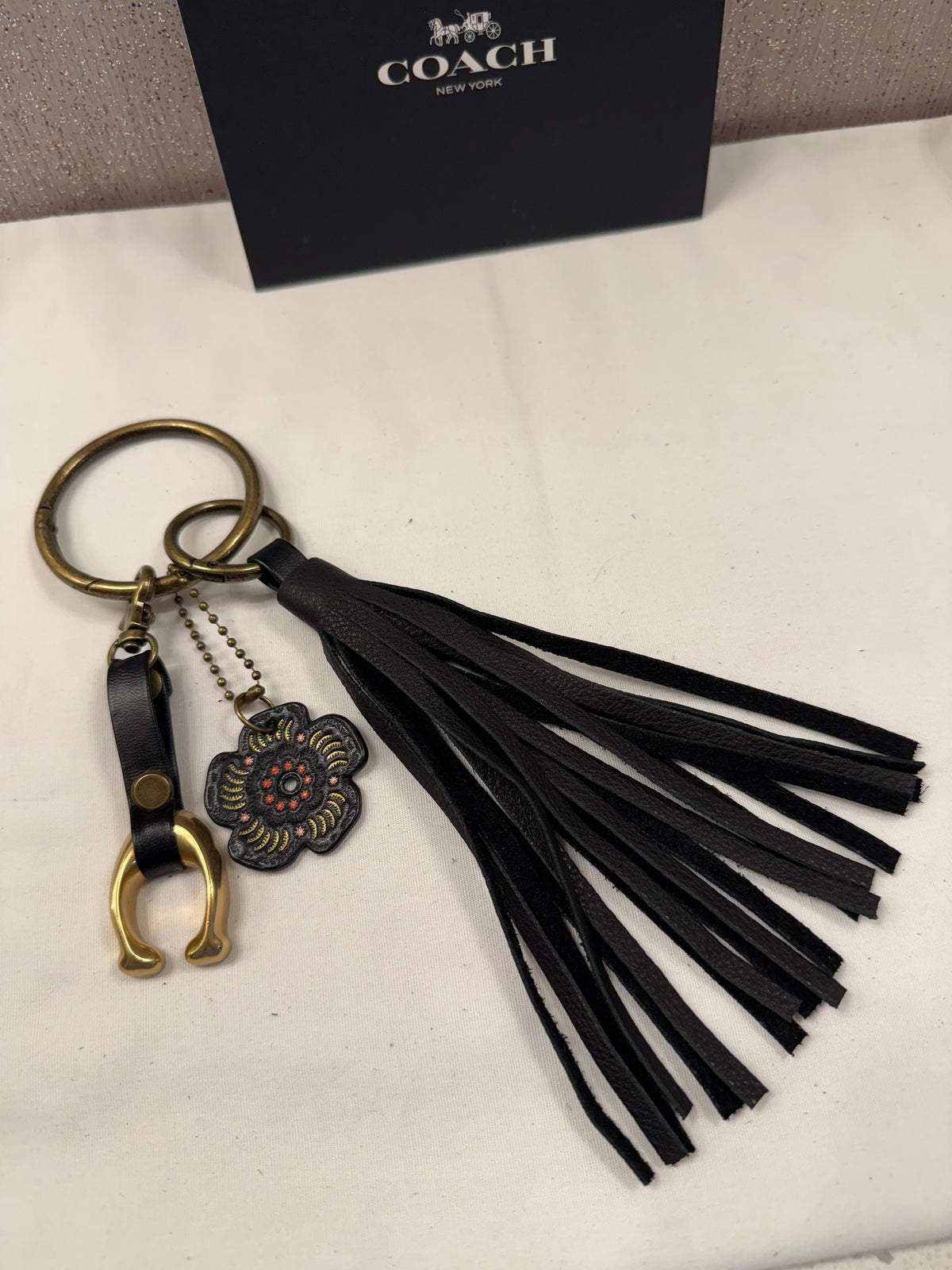 Ships 10.13.26 Bag Charm Cluster with a Repurposed Coach C from Tic Tac Toe Board, Coach Tea Rose, and Handmade Leather Tassel Bag Charm Cluster