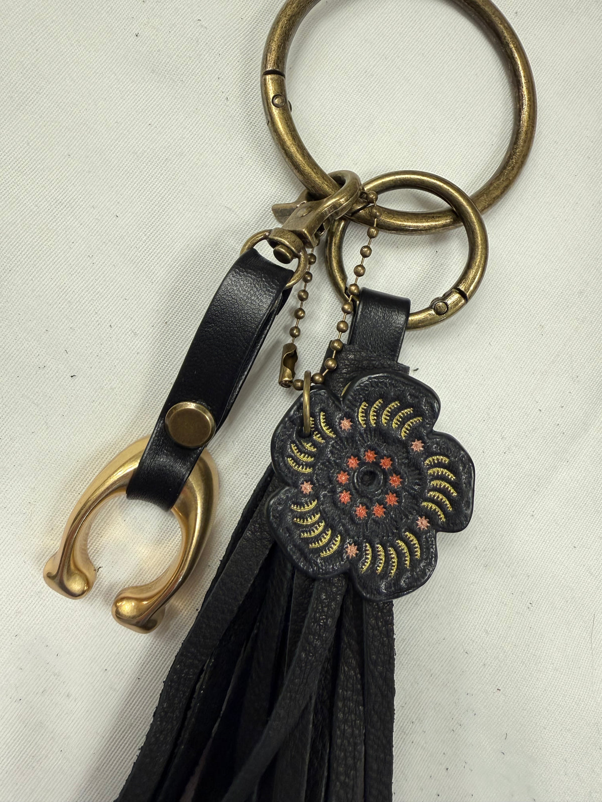 Ships 10.13.26 Bag Charm Cluster with a Repurposed Coach C from Tic Tac Toe Board, Coach Tea Rose, and Handmade Leather Tassel Bag Charm Cluster