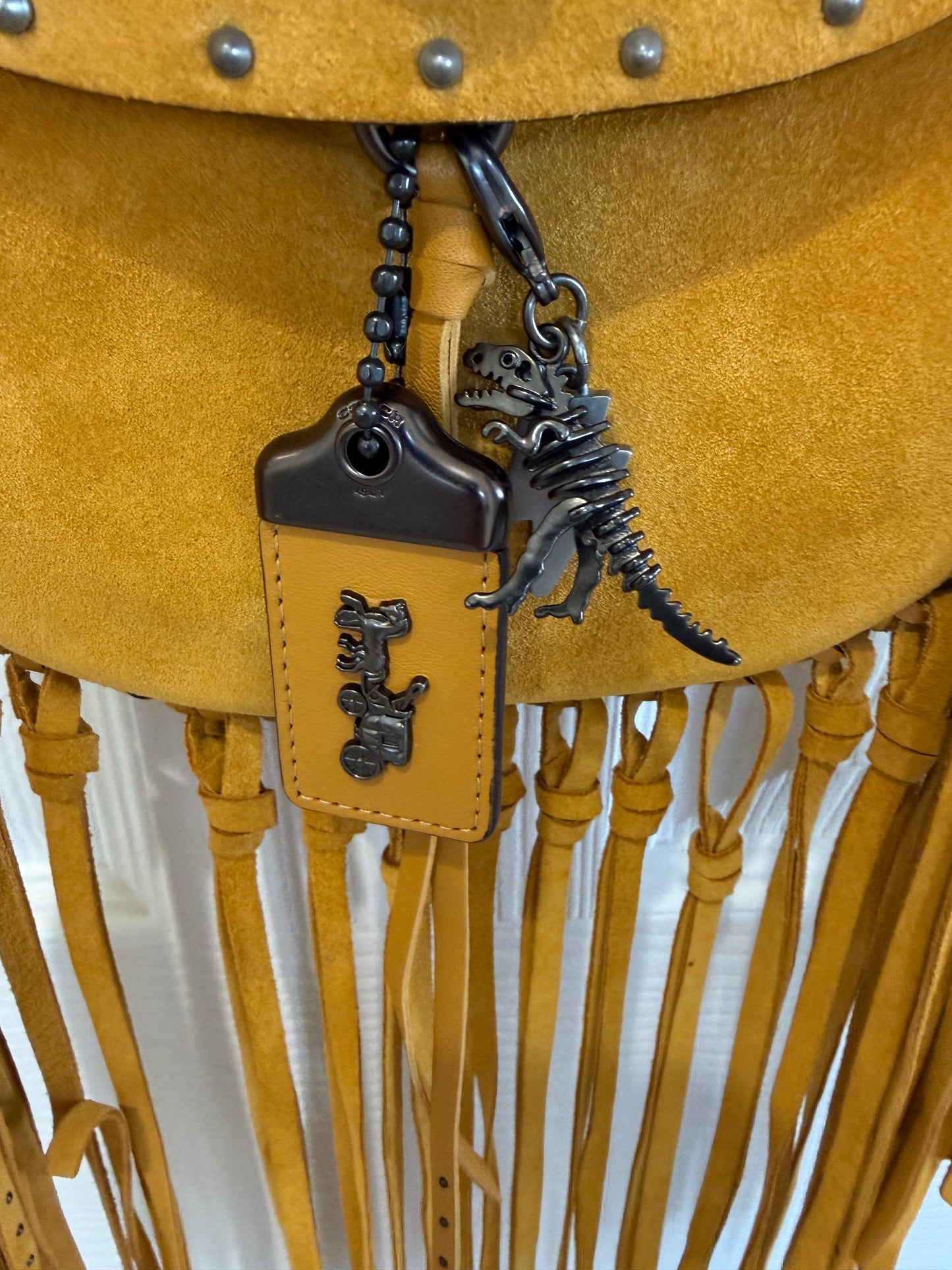 Coach Mustard Yellow Suede Fringe Saddle Crossbody Bag with original charm- EUC Pre-loved