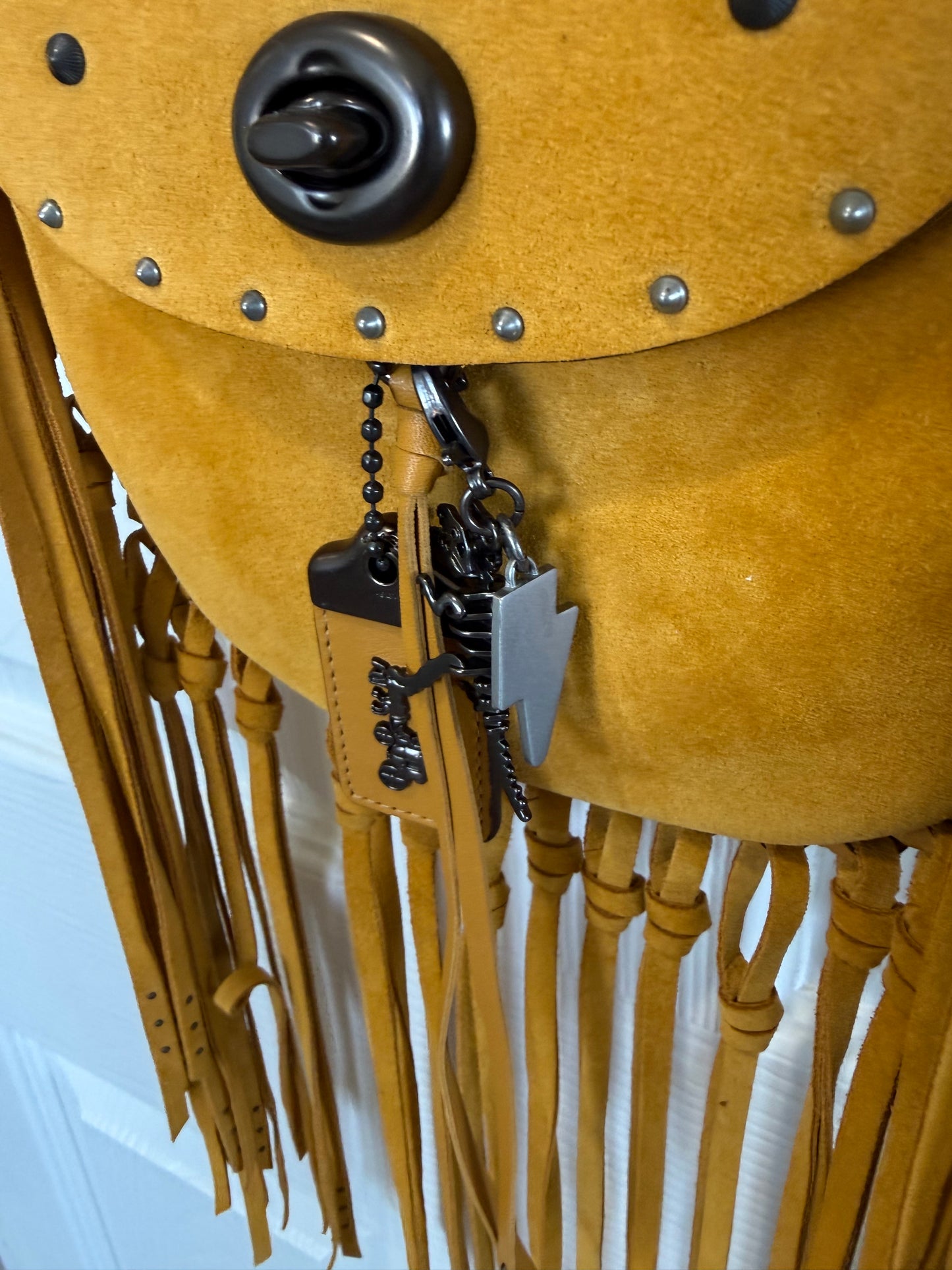 Coach Mustard Yellow Suede Fringe Saddle Crossbody Bag with original charm- EUC Pre-loved