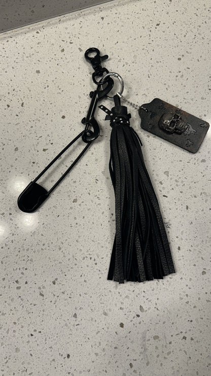 Upcrafted Coach Hangtag, Safety Pin, and Pebbled Leather Tassel Bag Charm Cluster