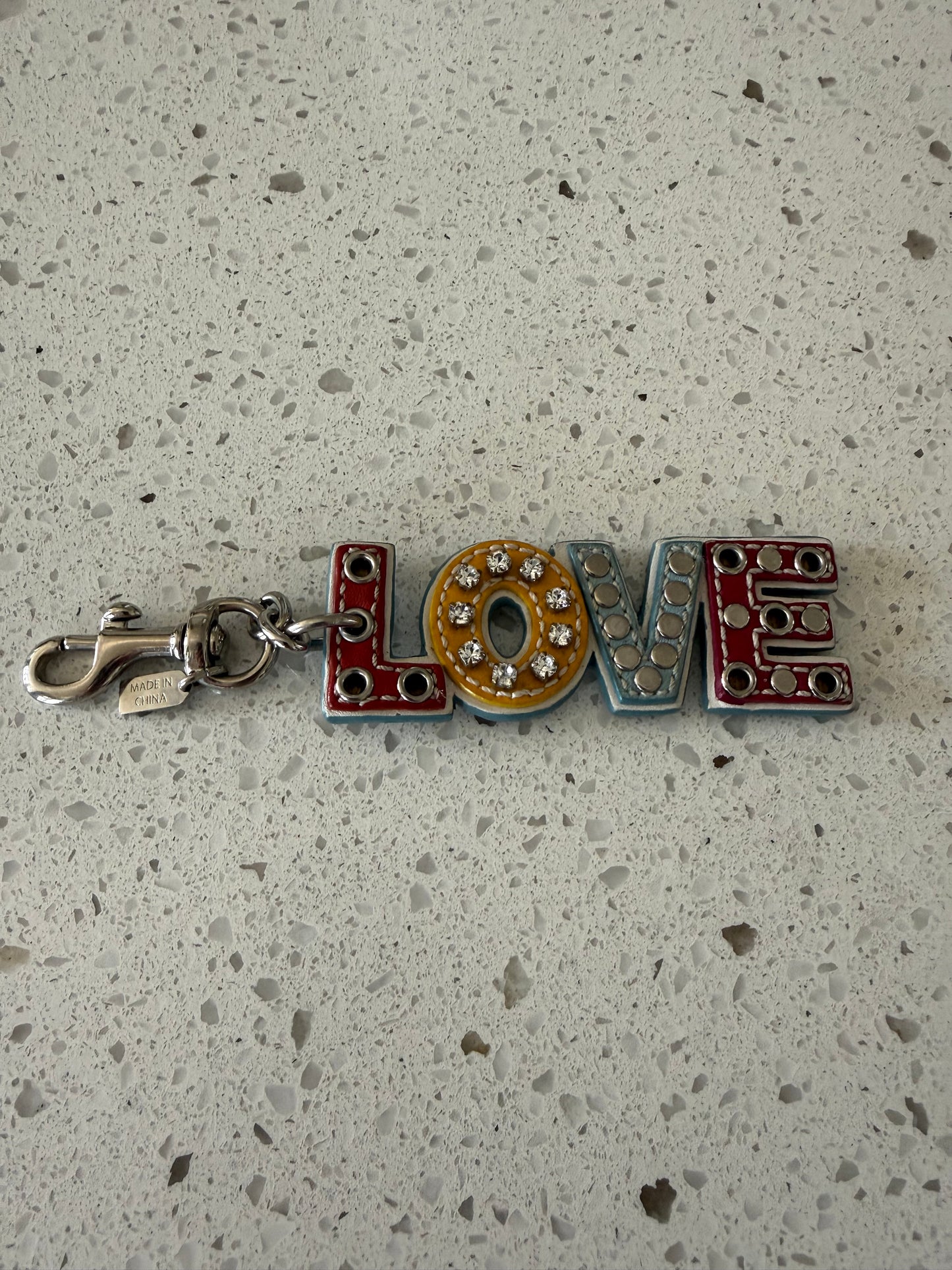 Pre-Loved Coach Multi-Color Leather "LOVE" Charm with Rhinestones Grommet Studs Optic C Print on the Back