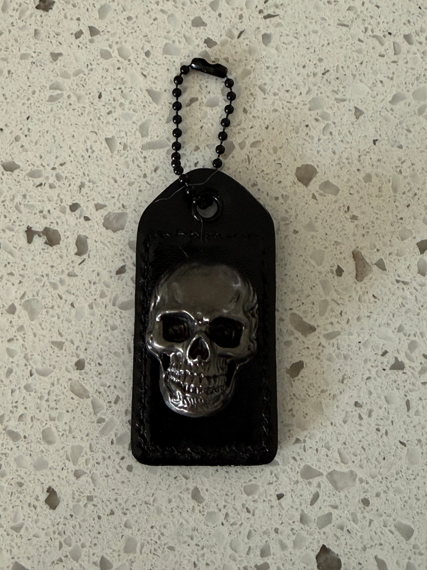 Repurposed Painted Black Coach Hangtag with Skull Rivet