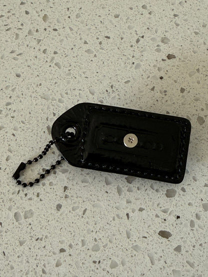 Repurposed Painted Black Coach Hangtag with Skull Rivet