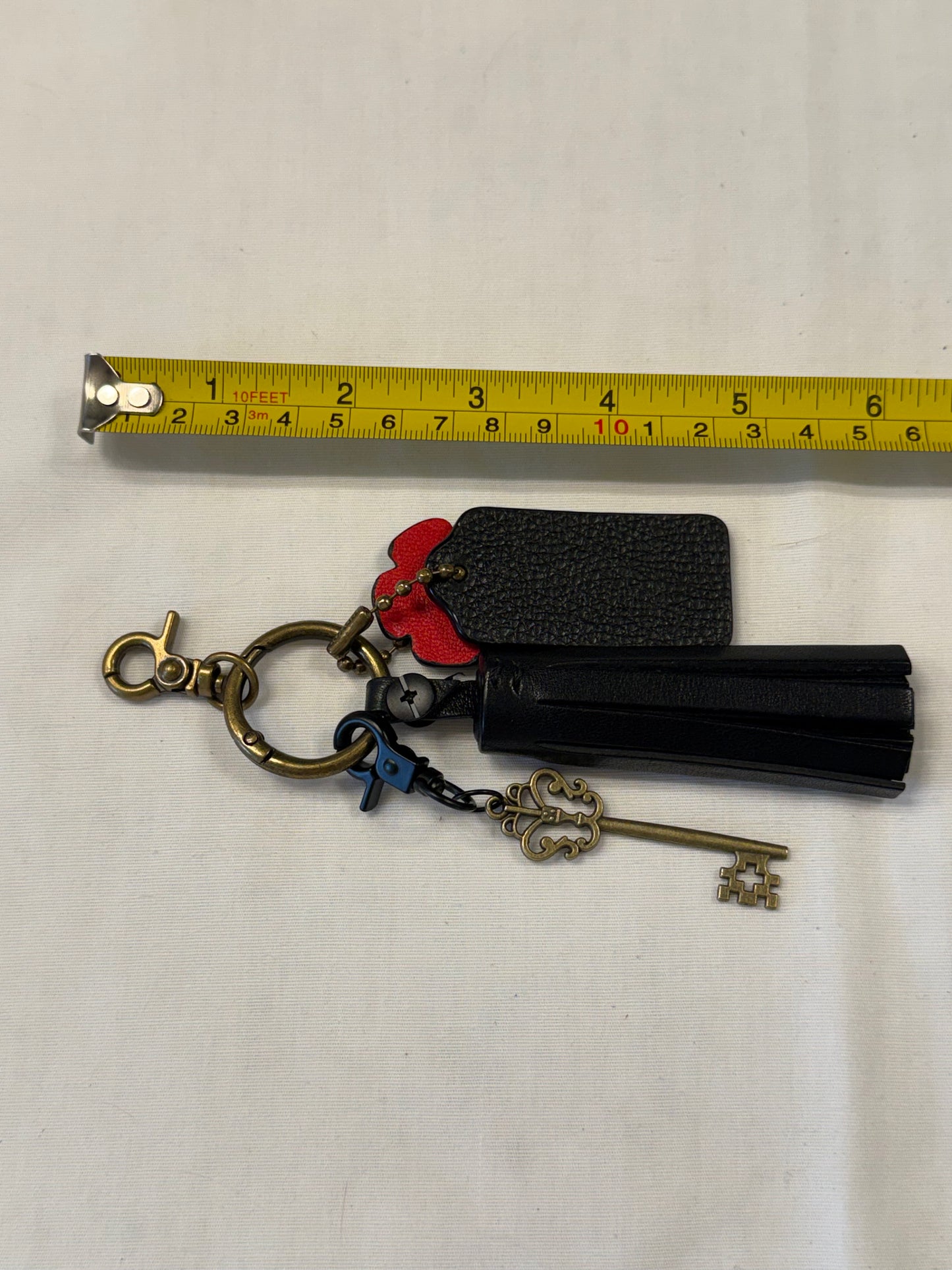 One-of-a-Kind Upcrafted Coach Bag Charm Cluster | Black Leather Tassel, Tea Rose, Hangtag & Key Charm