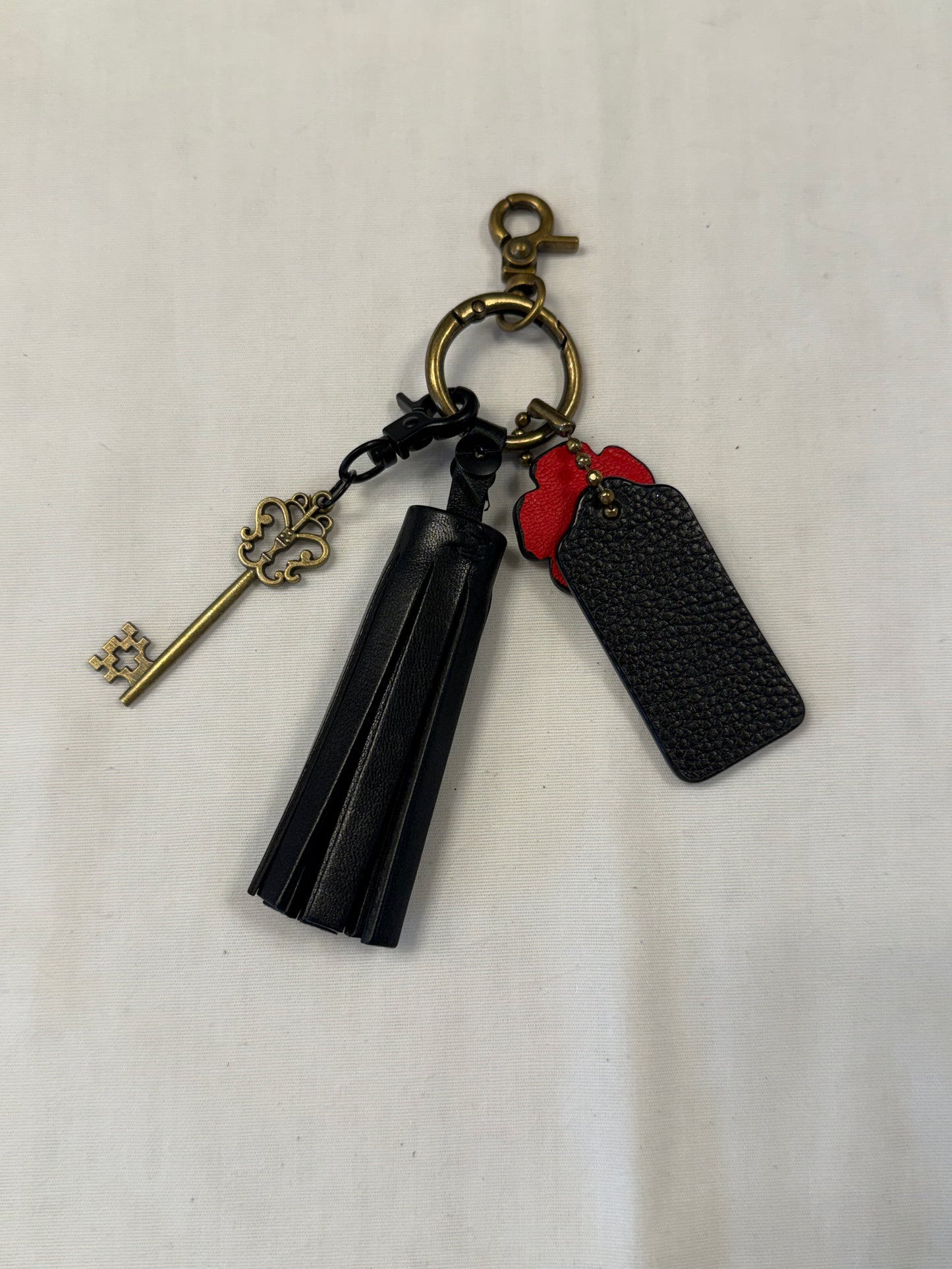 One-of-a-Kind Upcrafted Coach Bag Charm Cluster | Black Leather Tassel, Tea Rose, Hangtag & Key Charm