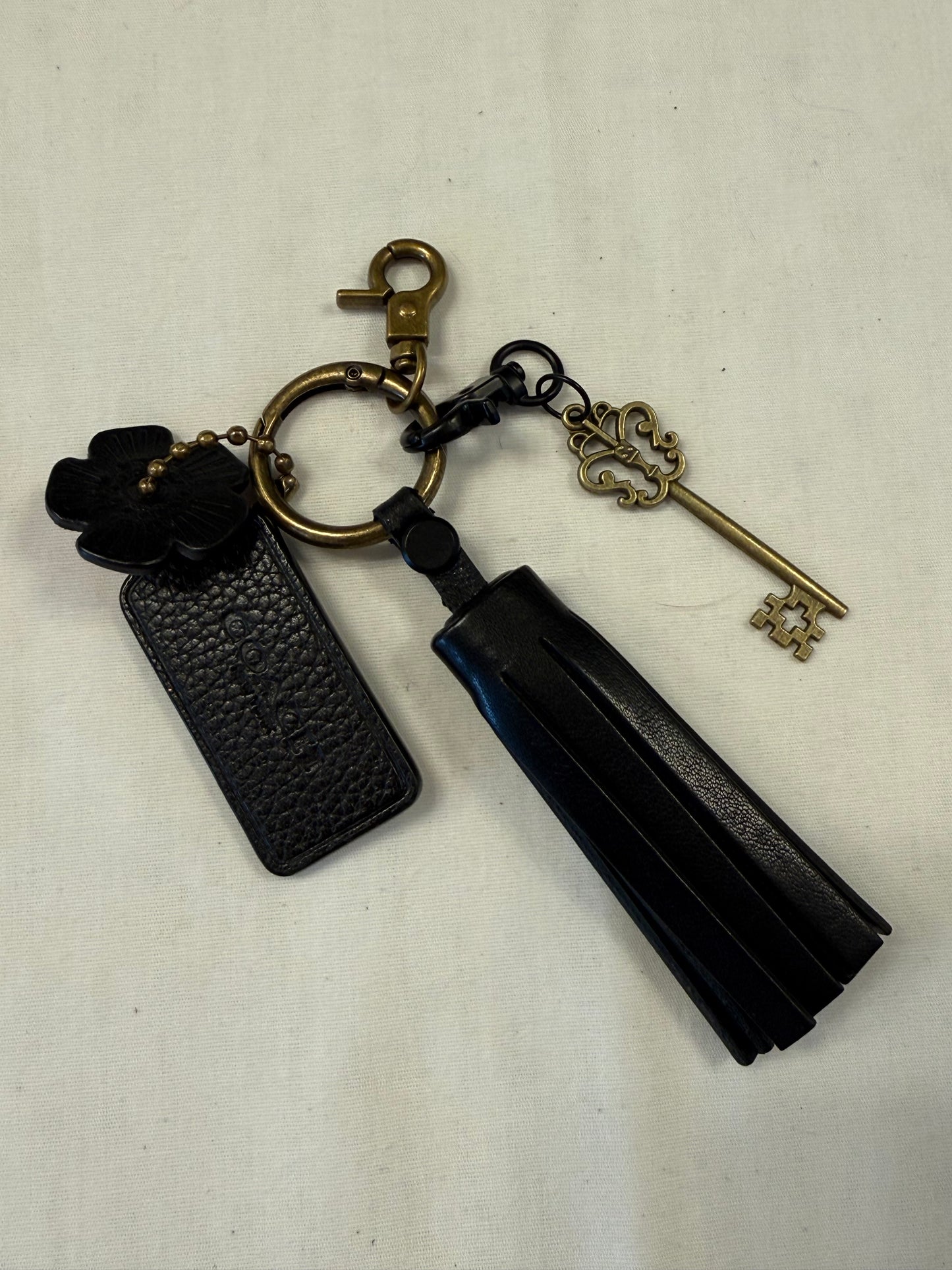 One-of-a-Kind Upcrafted Coach Bag Charm Cluster | Black Leather Tassel, Tea Rose, Hangtag & Key Charm