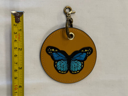 One-of-a-Kind Upcrafted Coach Coaster Bag Charm | Yellow Leather with Blue Butterfly Patch